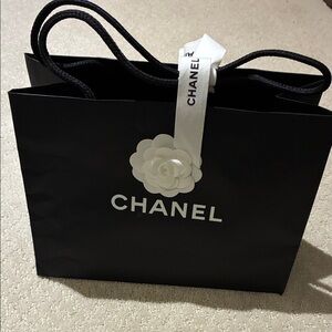 CHANEL Black Paper Shopping Tote with White Camellia Detail